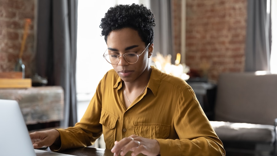 Businesswoman calculating data at her computer.