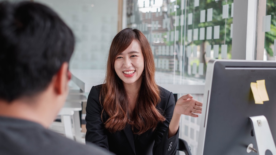 A person sitting at a table with a man.