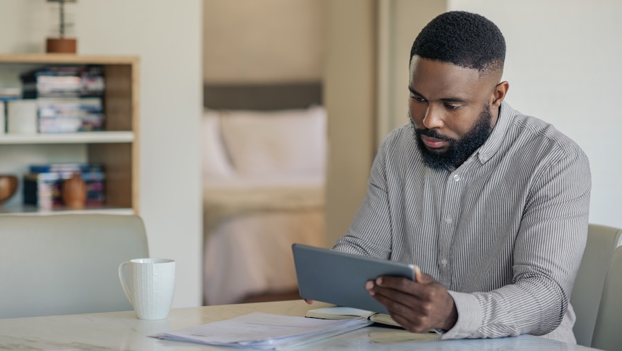 A businessman working on social media from home.