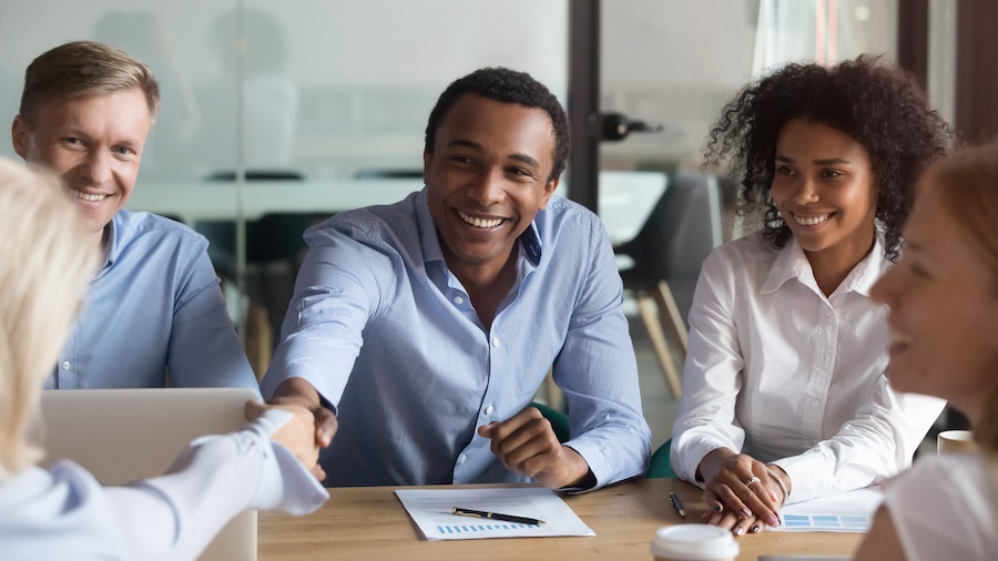 Group of people smiling and talking.