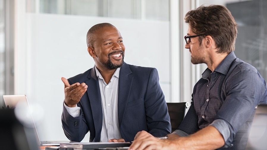 Accountant discussing accounting advisory services with a client.