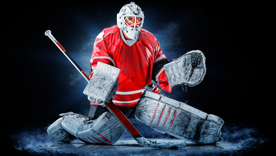 A hockey goalie in position to make a save.