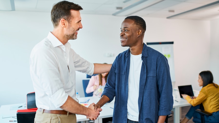 Accountant welcoming a new member of the staff.