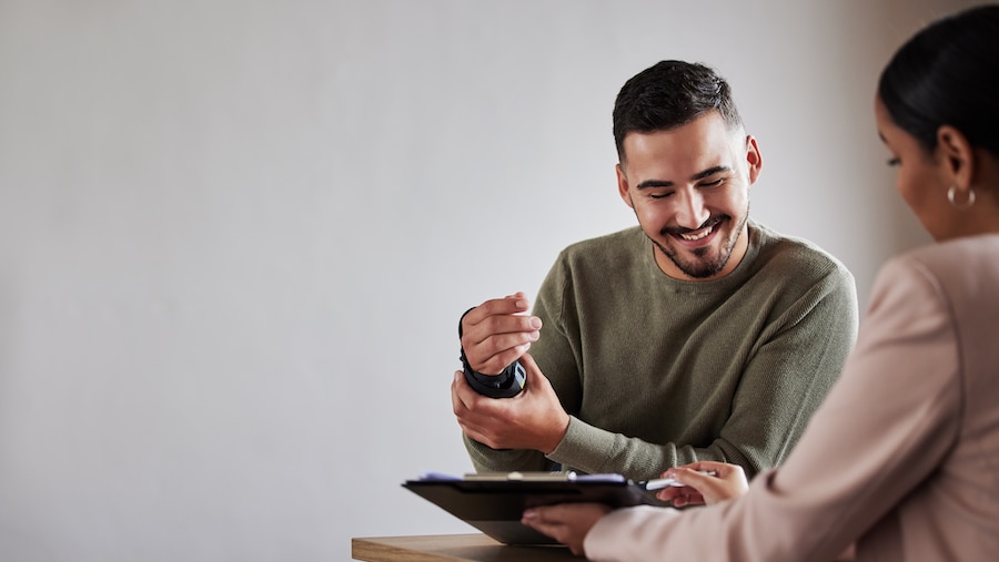 A businesswoman helping a client with workers' comp.