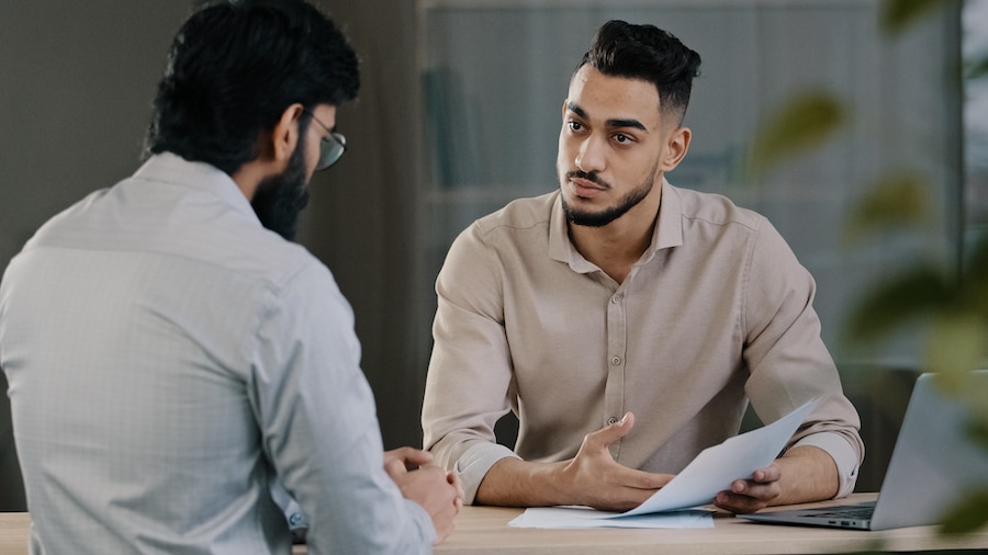 Meeting with a self-employed tax client to discuss financial wellness.