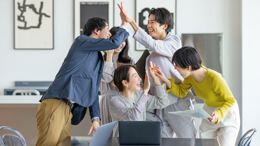 A team celebrating at their firm.