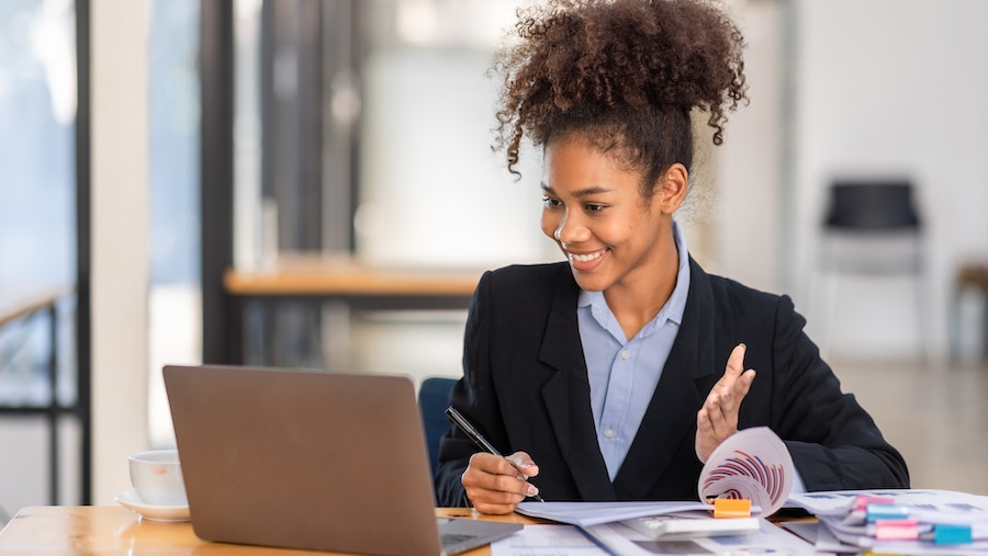 Accountant reconciling her QuickBooks on her laptop.