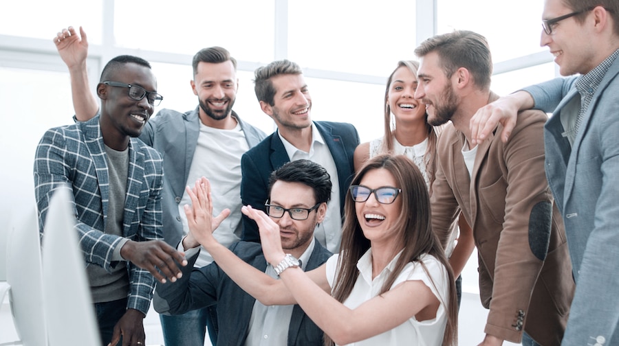 A team of people celebrating success.