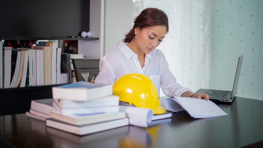 Contractor working on construction accounting in the office. 