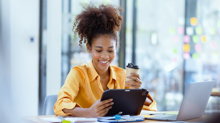 Bookkeeper on a tablet at her desk. 