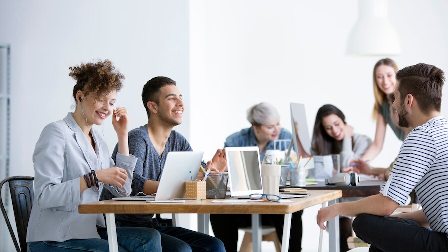 A team of people meeting and talking.