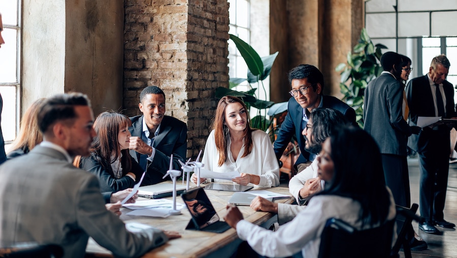 A group of people sitting around a table.