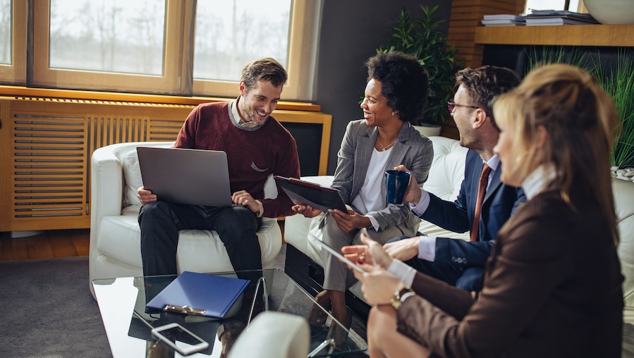 Accountants meeting with clients to discuss payroll.