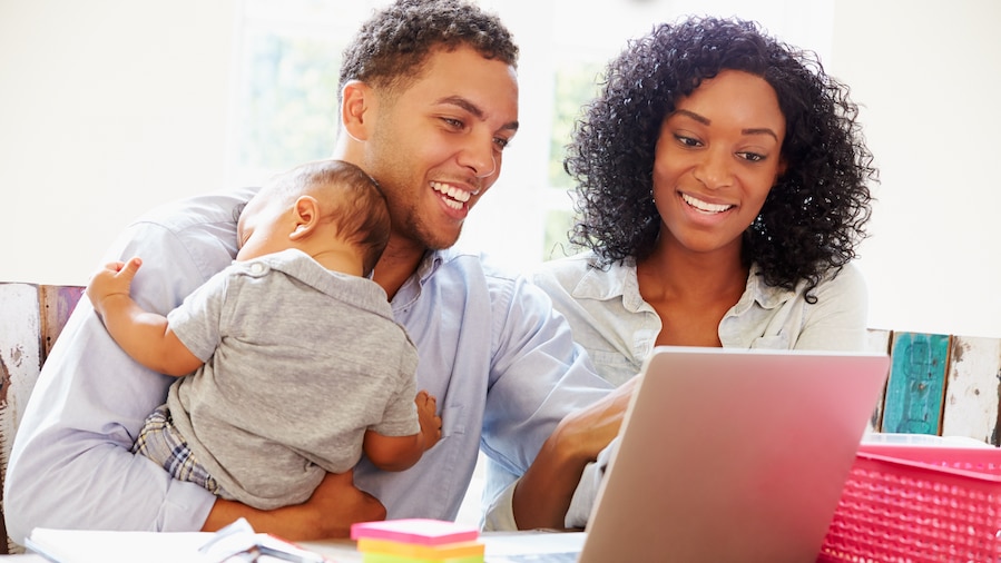 Family reviewing their business on their computer.