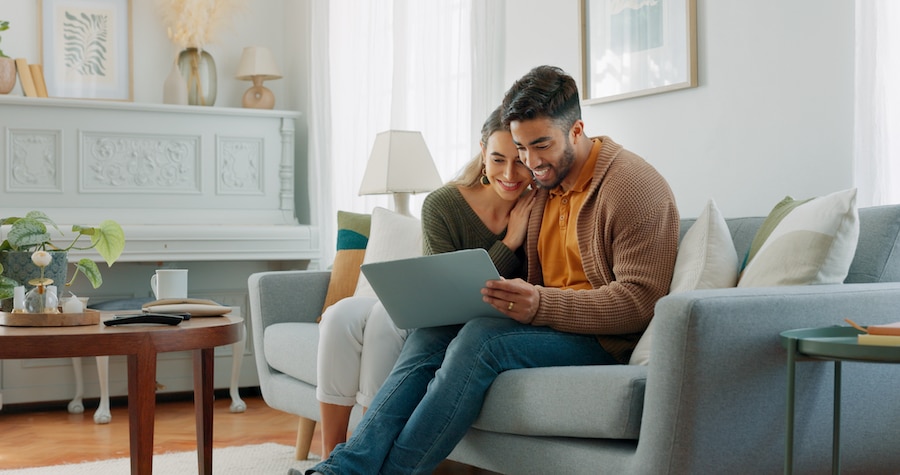 A couple reviewing information on their computer. 