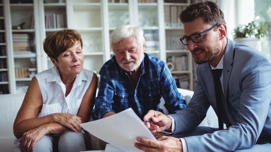 Tax advisor breaking down real estate planning with a couple.