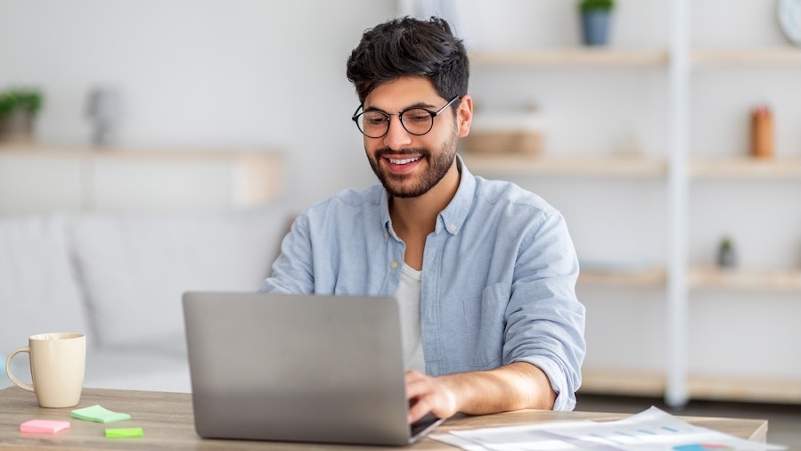 A business owner navigating SEO on his laptop.